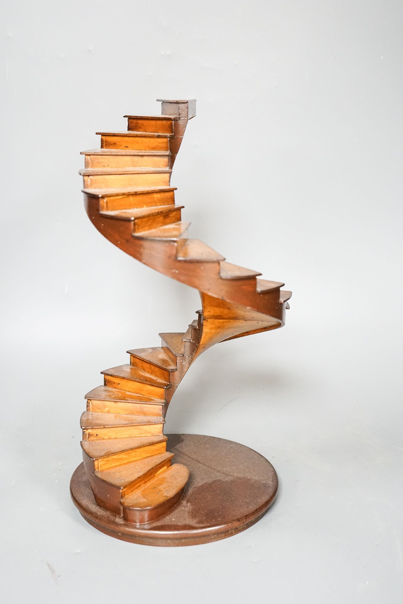 A small wood model spiral staircase together with a section of plaster frieze work (2) 37cm